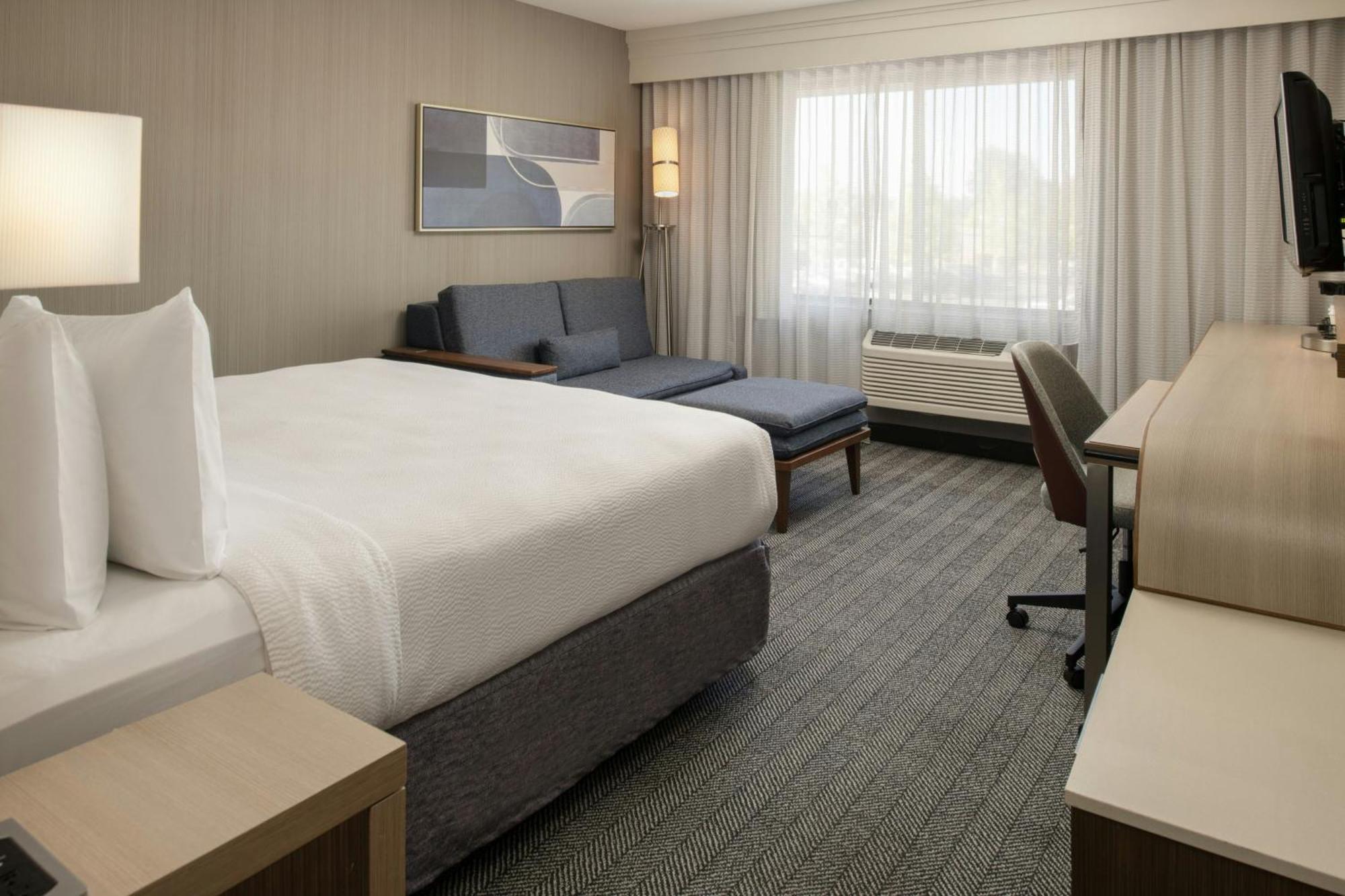 King Room with Sofa Bed and Roll-in Shower - Mobility and Hearing Accessible