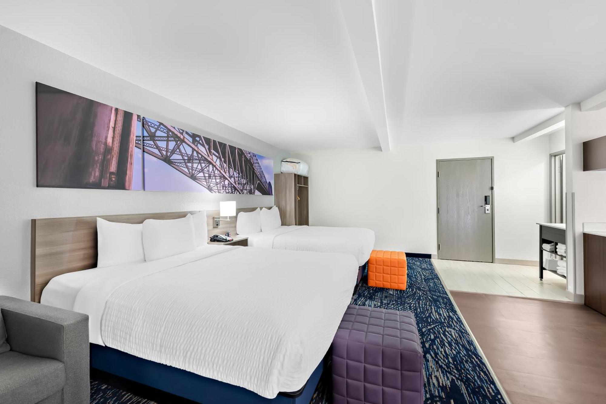 Efficiency Quadruple Room with Two Queen Beds - Non Smoking